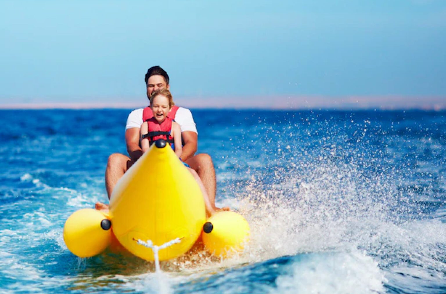 A man enjoying banana boat ride on Dubai Sea