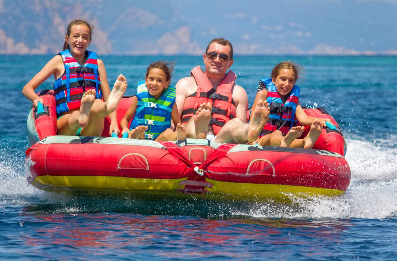 A Family enjoying a fun-filled donut ride in Dubai