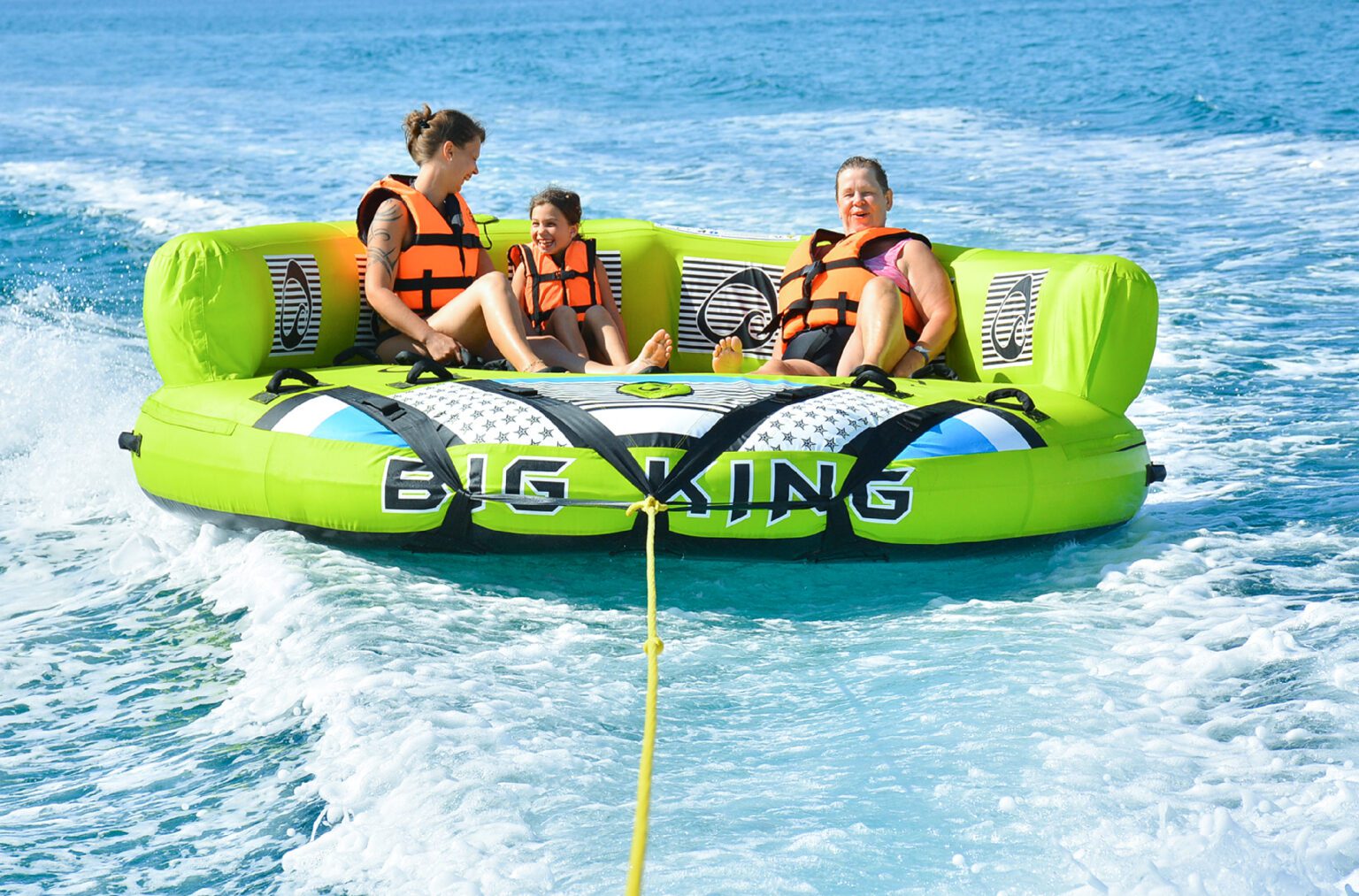 A family sitting and relaxing on a Donut Ride in Dubai