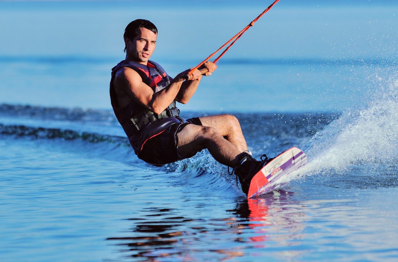 A rushing on the waves of Arabian Gulf on Wake boarding