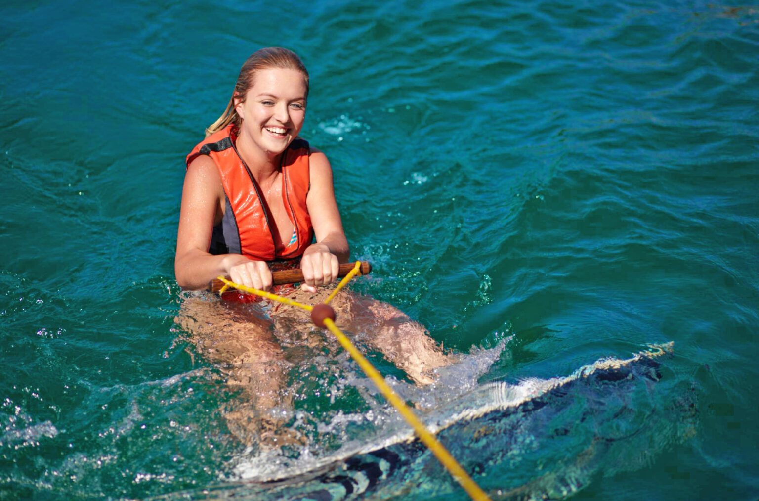 A girl enjoying wakeboarding on Dubai Yachts